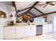 Bright kitchen with stone counters and stainless steel dishwasher at 2223 Wildwood Hollow Dr, Valrico, FL 33596