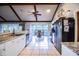 Open kitchen and breakfast nook with stainless steel appliances and sunlit bay window at 2223 Wildwood Hollow Dr, Valrico, FL 33596