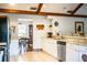Bright kitchen with stone counters and stainless steel dishwasher, view to the dining room at 2223 Wildwood Hollow Dr, Valrico, FL 33596
