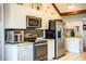 Bright kitchen features stainless steel appliances, granite countertops, and white cabinetry at 2223 Wildwood Hollow Dr, Valrico, FL 33596