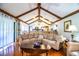 Cozy living room flows into kitchen area with breakfast bar, with vaulted ceilings and hardwood floors at 2223 Wildwood Hollow Dr, Valrico, FL 33596
