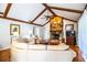 Cozy living room boasting a striking stone fireplace and comfortable seating arrangement at 2223 Wildwood Hollow Dr, Valrico, FL 33596