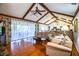 Spacious living room flows into kitchen and dining area with hardwood floors and vaulted ceilings at 2223 Wildwood Hollow Dr, Valrico, FL 33596