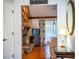 Living room with vaulted ceilings and exposed beams. Stone fireplace feature at 2223 Wildwood Hollow Dr, Valrico, FL 33596
