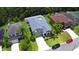 Charming two-story home boasts a well-manicured lawn, complemented by lush landscaping and a lengthy driveway at 2721 Walden Woods Dr, Plant City, FL 33566