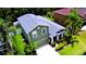 Inviting two-story home showcases verdant landscaping, a covered porch, and a convenient attached garage at 2721 Walden Woods Dr, Plant City, FL 33566