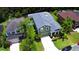 Charming two-story home boasts a well-manicured lawn, complemented by lush landscaping and a lengthy driveway at 2721 Walden Woods Dr, Plant City, FL 33566