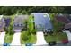 Charming two-story home boasts a well-manicured lawn, complemented by lush landscaping and a lengthy driveway at 2721 Walden Woods Dr, Plant City, FL 33566