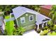 Aerial shot of home, manicured landscaping, backyard shed, and vibrant green lawn at 2721 Walden Woods Dr, Plant City, FL 33566