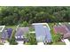 Aerial view of single-Gathering homes with well-maintained lawns and mature trees, enhanced by a white fence at 2721 Walden Woods Dr, Plant City, FL 33566