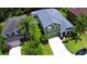 Lovely two-story home with a large, fenced-in backyard, lush greenery, and an attached two-car garage at 2721 Walden Woods Dr, Plant City, FL 33566