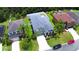Charming two-story home boasts a well-manicured lawn, complemented by lush landscaping and a lengthy driveway at 2721 Walden Woods Dr, Plant City, FL 33566