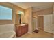 Bathroom featuring a large soaking tub, single sink, and stand up shower at 2721 Walden Woods Dr, Plant City, FL 33566