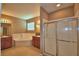 Bathroom featuring a large soaking tub, walk in shower, double sinks, and neutral colored walls at 2721 Walden Woods Dr, Plant City, FL 33566