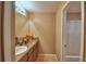 Bathroom with a sink, large mirror, vanity, and a separate room for the toilet and bathtub at 2721 Walden Woods Dr, Plant City, FL 33566