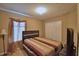 Comfortable bedroom with a bed, window, and closet, creating a cozy and inviting space at 2721 Walden Woods Dr, Plant City, FL 33566