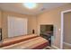 Comfortable bedroom with a bed, window, and closet, creating a cozy and inviting space at 2721 Walden Woods Dr, Plant City, FL 33566