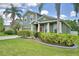 Charming home with well-maintained landscaping, a lush green lawn, and a classic front facade at 2721 Walden Woods Dr, Plant City, FL 33566