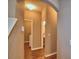 Hallway that leads to a laundry room on the left and a half bath on the right at 2721 Walden Woods Dr, Plant City, FL 33566