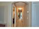 Hallway with neutral walls, carpeted floors, and doors leading to different rooms in the home at 2721 Walden Woods Dr, Plant City, FL 33566