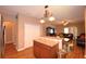The Kitchen and dining area with wood floors features wooden cabinets and stainless appliances at 2721 Walden Woods Dr, Plant City, FL 33566