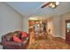 Open concept living room and dining area with wood floors and comfortable seating at 2721 Walden Woods Dr, Plant City, FL 33566