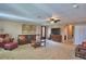 Cozy living room with carpet, comfortable seating, and entertainment center at 2721 Walden Woods Dr, Plant City, FL 33566