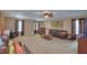 Spacious living room with carpet, comfortable seating, and neutral wall color at 2721 Walden Woods Dr, Plant City, FL 33566