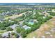 This aerial view captures the home's location, nestled amidst greenery, golf course, and community amenities at 34852 Teeview Ln, Zephyrhills, FL 33541
