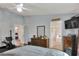 Spacious bedroom with Primary bathroom access and hardwood floors at 34852 Teeview Ln, Zephyrhills, FL 33541