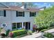 Two-story home with dark shutters and well-maintained landscaping at 34852 Teeview Ln, Zephyrhills, FL 33541