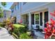 Charming townhome showcasing a well-manicured garden and welcoming porch at 34852 Teeview Ln, Zephyrhills, FL 33541