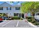 Beautiful townhome featuring manicured landscaping and assigned parking, enhancing its curb appeal and convenience at 34852 Teeview Ln, Zephyrhills, FL 33541
