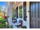 Inviting front porch with chairs, perfect for enjoying the outdoors at 34852 Teeview Ln, Zephyrhills, FL 33541