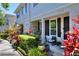 Welcoming front porch with seating and attractive landscaping at 34852 Teeview Ln, Zephyrhills, FL 33541