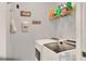 Laundry room features modern washer and dryer at 34852 Teeview Ln, Zephyrhills, FL 33541