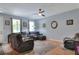 Spacious living room with hardwood floors, plenty of natural light at 34852 Teeview Ln, Zephyrhills, FL 33541