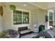 Enclosed outdoor patio with an outdoor grill and seating at 34852 Teeview Ln, Zephyrhills, FL 33541