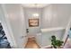 Traditional stairwell with wood stairs, neutral paint, and decorative painting at 34852 Teeview Ln, Zephyrhills, FL 33541
