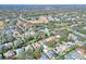 Neighborhood aerial view showcasing a residential area with mature trees, lawns, and neatly arranged houses at 3507 Autumn Glen Dr, Valrico, FL 33596
