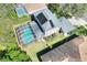 Aerial view of backyard featuring a screened pool, solar panels, and well-maintained landscaping at 3507 Autumn Glen Dr, Valrico, FL 33596