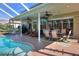 Outdoor covered back patio with pool at 3507 Autumn Glen Dr, Valrico, FL 33596