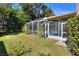 The property boasts a lush backyard with a screened-in pool and patio at 3507 Autumn Glen Dr, Valrico, FL 33596