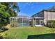 Well-maintained backyard with screened-in pool area, ideal for outdoor enjoyment at 3507 Autumn Glen Dr, Valrico, FL 33596