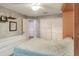 A bedroom features a soft comforter, carpet, and closet with a view of the ensuite bathroom at 3507 Autumn Glen Dr, Valrico, FL 33596