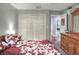This bedroom features a closet with double doors, gray walls and wood accents at 3507 Autumn Glen Dr, Valrico, FL 33596