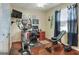 Bedroom featuring hardwood floors, an exercise bike, a desk, and bright lighting at 3507 Autumn Glen Dr, Valrico, FL 33596