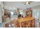 Open dining area with kitchen access, hardwood floors, and natural light at 3507 Autumn Glen Dr, Valrico, FL 33596