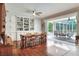 Formal dining room featuring hardwood floors, and built-in cabinets at 3507 Autumn Glen Dr, Valrico, FL 33596