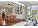 Dining room with hardwood floors, built-in cabinets, and sliding glass doors to the lanai at 3507 Autumn Glen Dr, Valrico, FL 33596